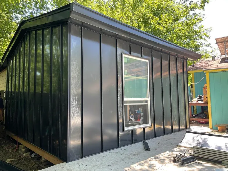 Black standing seam metal wall panels for Metal Roof Installation in Rapho